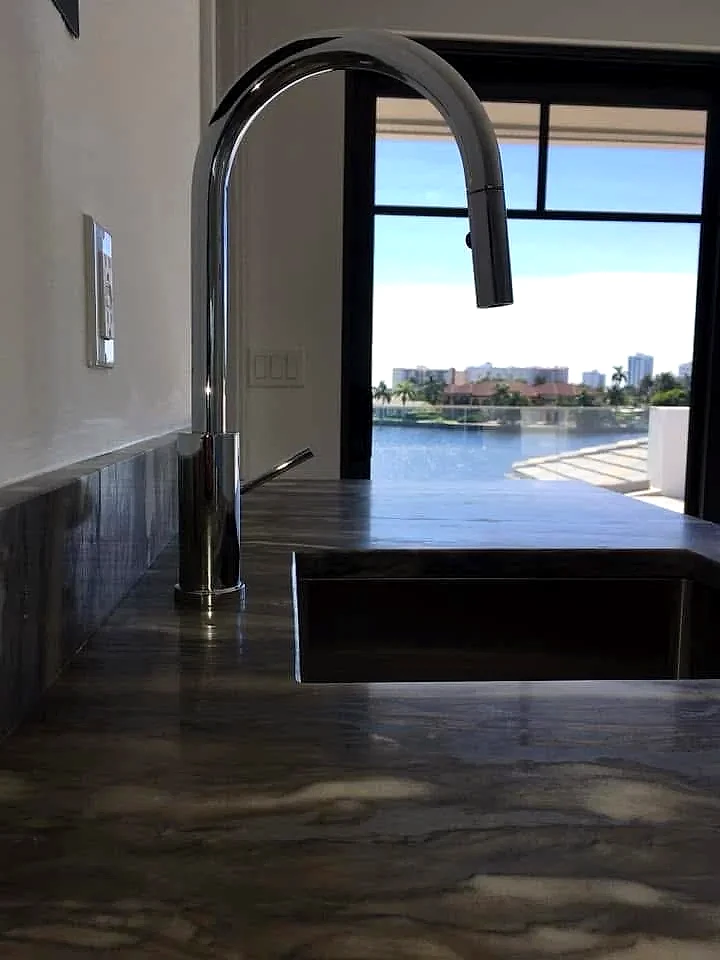 Pull-down kitchen faucet installed at a waterfront home kitchen, South Florida