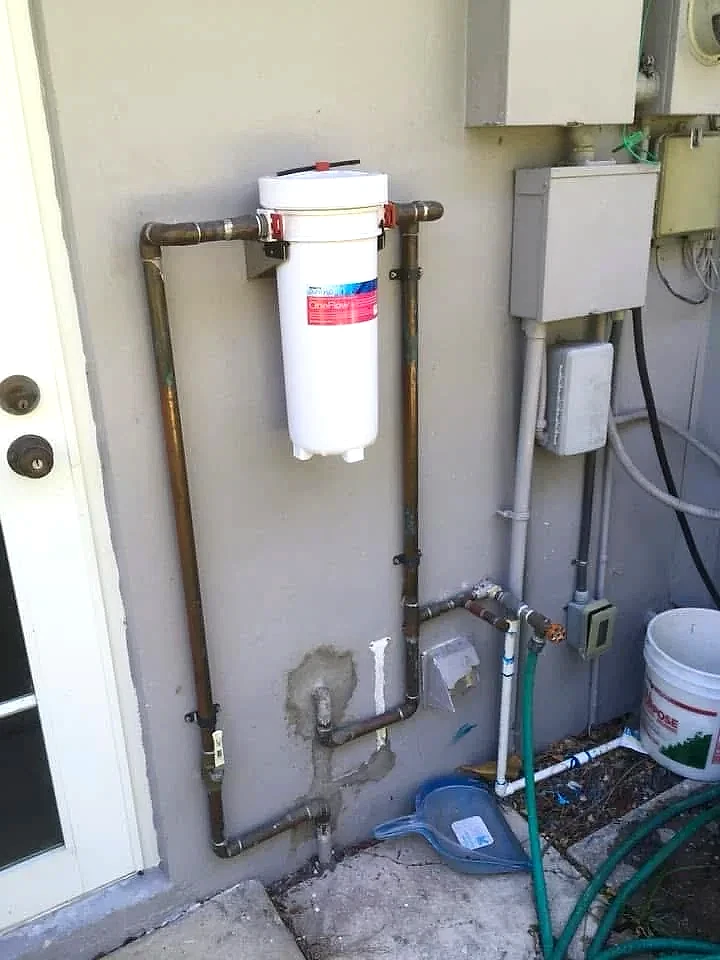 Whole-house water filter installed on the main copper supply line of a Florida home